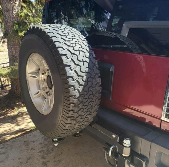 USA USA-EB148527 ТРИМАЧ ЗАПАСНОГО КОЛЕСА HUMMER H2 03-09