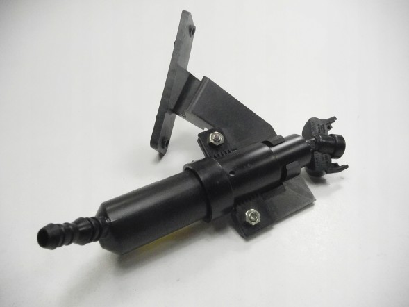 Ford OE 1346677 Форсунка омийника фар - права сторона ford mondeo oe 1346677