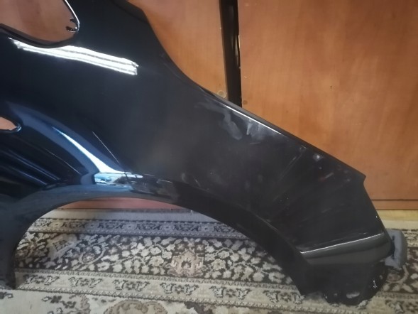 Китай 551102 Opel Astra 4 J IV правий срібний бризковик Z176