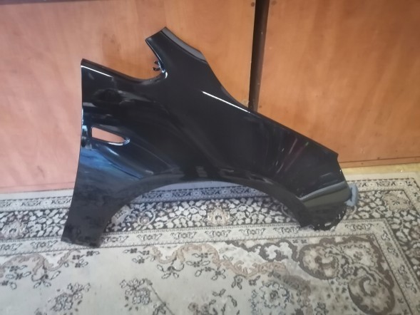 Китай 551102 Opel Astra 4 J IV правий срібний бризковик Z176