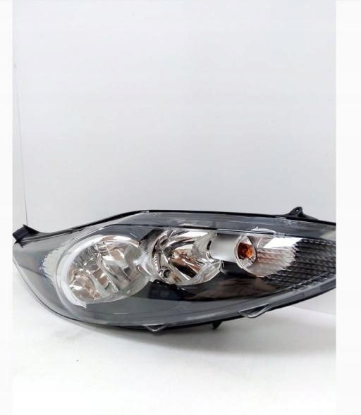 Hella 1EJ 247 045-321 Hella 1ej 247 045-321 фара ford fiesta vi . Увага потріскана зачіпка.