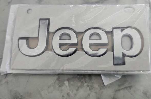 Mopar 68464753AC ЕМБЛЕМА НА КАПОТ JEEP GRAND CHEROKEE 2021 - 2025 рр.